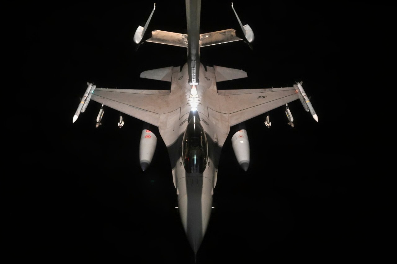 A U.S. Air Force F-16 Fighting Falcon assigned to the 77th Expeditionary Fighter Squadron, receives fuel from a KC-10 Extender assigned to the 908th Expeditionary Air Refueling Squadron, over an undisclosed location within the U.S. Central Command area of responsibility, Dec. 2, 2022. F-16 aircraft routinely conduct presence patrols within the CENTCOM AOR to reassure allies and ensure regional security. (U.S. Air Force photo by Staff Sgt. Gerald R. Willis)