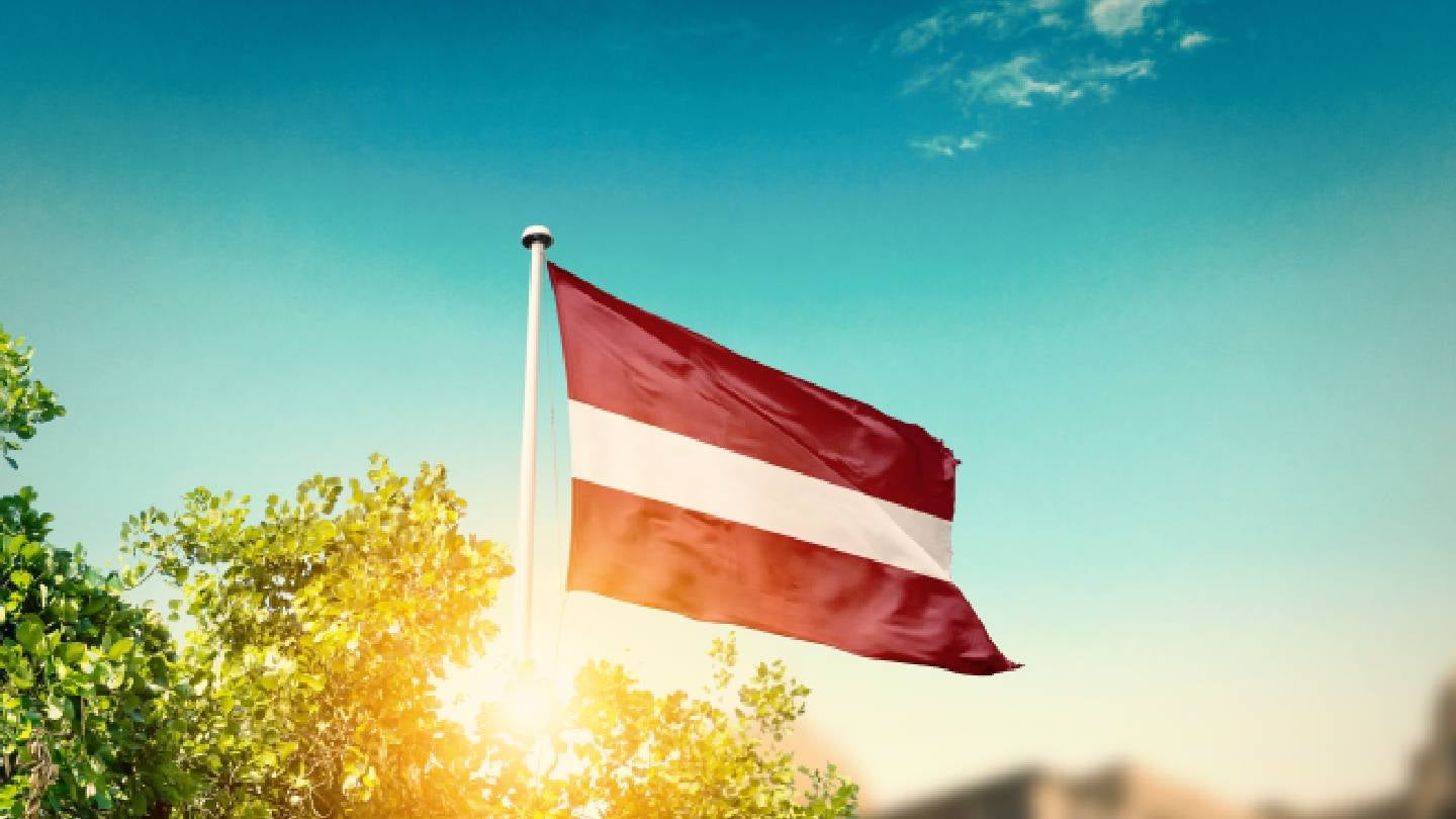 Latvian national flag symbolizing Baltic defense and NATO eastern flank