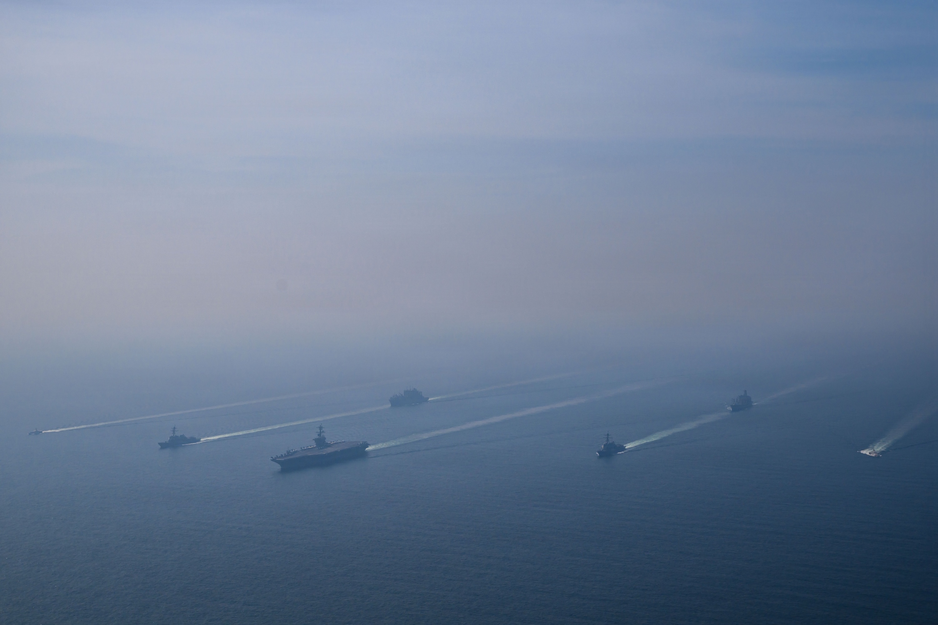 The aircraft carrier USS Abraham Lincoln leads a formation of ships in the Arabian Sea, Feb. 6, 2026. (MC1 Jesse Monford/U.S. Navy)