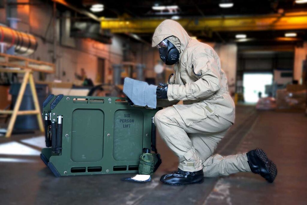 Protective suit incorporating Heathcoat Fabrics zirconium hydroxide fabric. Also note the prototype decontamination mitt made from the same material. [Heathcoat Fabrics]