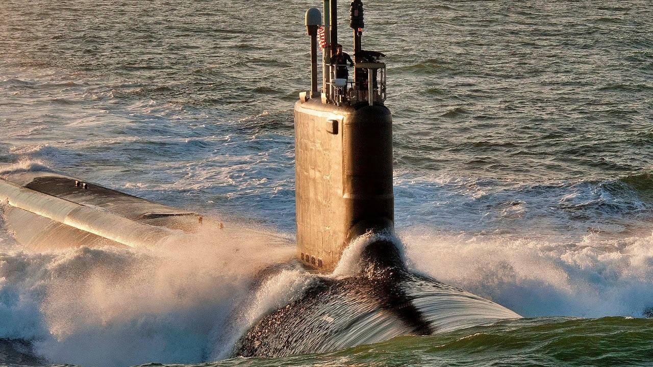 US Navy Virginia-class submarine underway with American flag in the Indo-Pacific