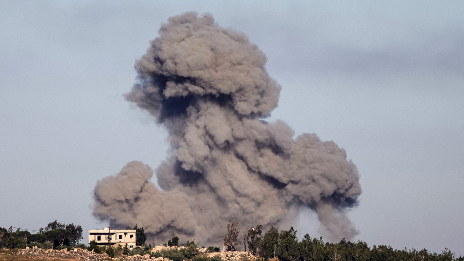 Israeli airstrike smoke plume over southern Lebanon near the border