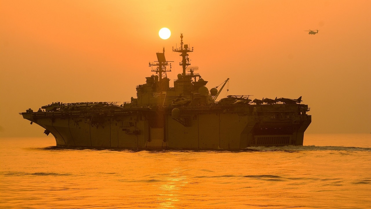 (Aug. 4, 2021) The Wasp-class amphibious assault ship USS Iwo Jima (LHD 7) transits the Strait of Hormuz, Aug. 4, 2021. Iwo Jima is deployed to the U.S. 5th Fleet area of operations to ensure maritime stability and security in the Central Region, connecting the Mediterranean and the Pacific through the western Indian Ocean and three strategic choke points. (U.S. Navy photo by Seaman Logan Kaczmarek)
