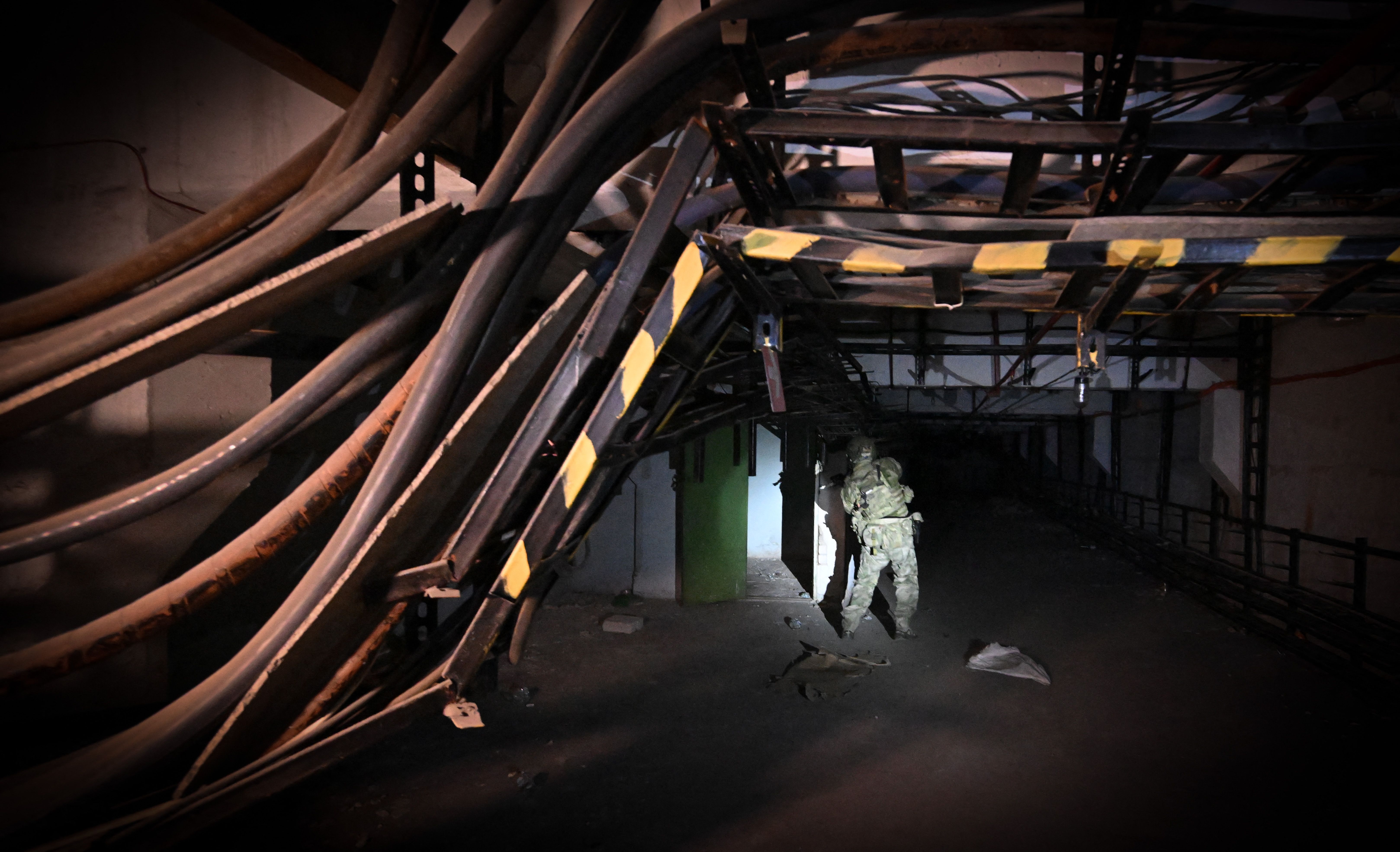 A Russian serviceman inspects an underground tunnel at the Azovstal steel plant in Mariupol amid the Russian invasion of Ukraine, on June 13, 2022. (Yuri Kadobnov/AFP via Getty Images)