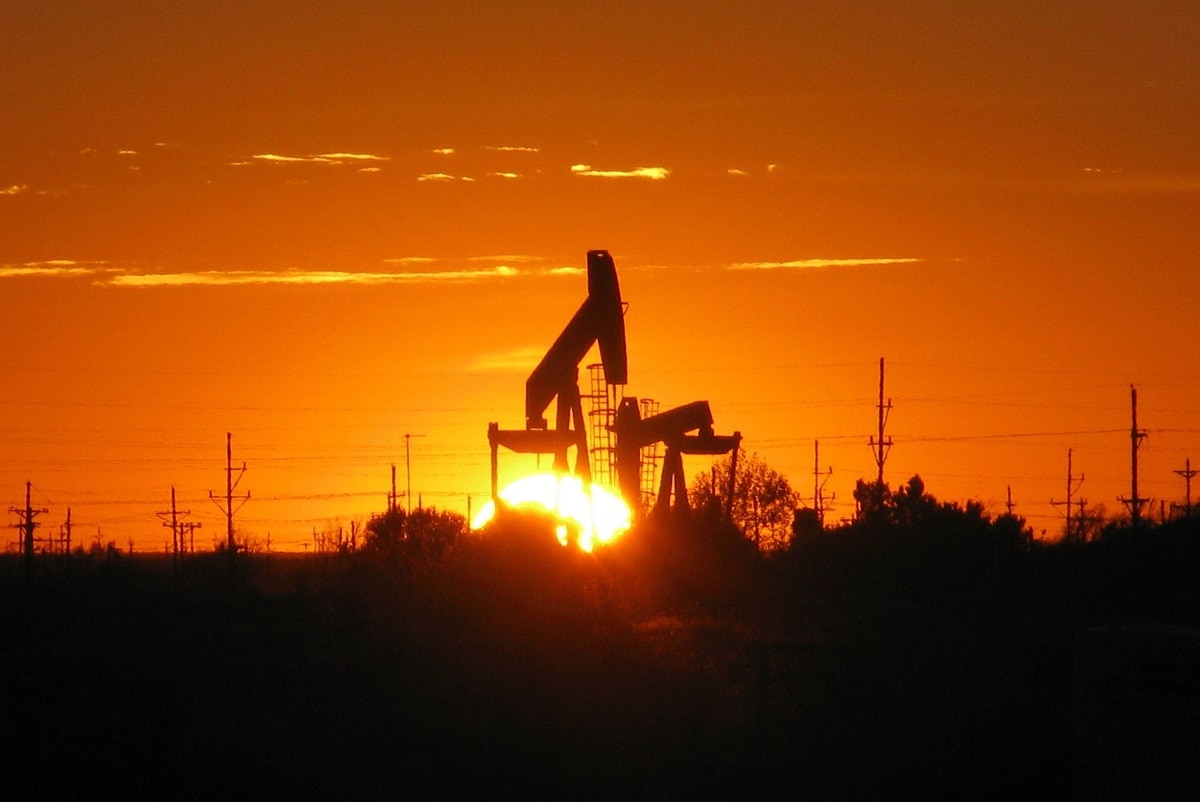 The sun sets behind a pump jack near Midland, TX. The oil and gas industry has many parts, from exploration and extraction (“upstream”) to processing and transportation (“downstream”), which often happen in close proximity to one another. These active wells are mere yards from wells being developed.