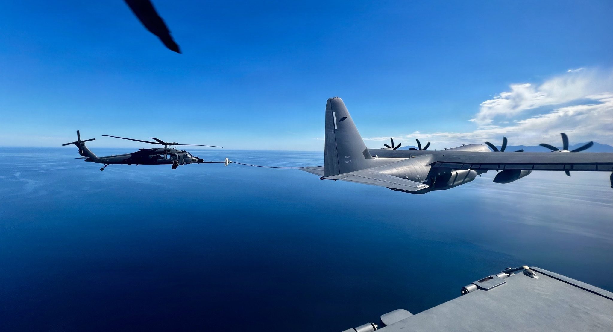U.S. Air Force aircraft from the 563rd Rescue Group perform air-to-air refueling during a rescue mission off the coast of Baja California, Mexico, Feb. 5, 2026. The nine-hour outbound flight was more demanding, requiring four air-to-air refueling operations before the aircraft reached the tanker vessel. (Courtesy photo)