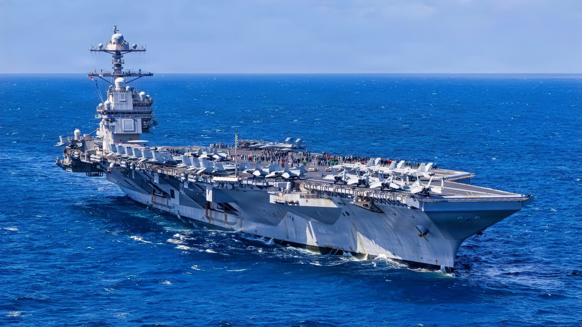 The world’s largest aircraft carrier, Ford-class aircraft carrier USS Gerald R. Ford (CVN 78), transits the Caribbean Sea during Carrier Air Wing 8’s aerial change of command ceremony, Jan. 19, 2026. U.S. military forces are deployed to the Caribbean in support of the U.S. Southern Command mission, Department of War-directed operations, and the president’s priorities to disrupt illicit drug trafficking and protect the homeland. (U.S. Navy photo)
