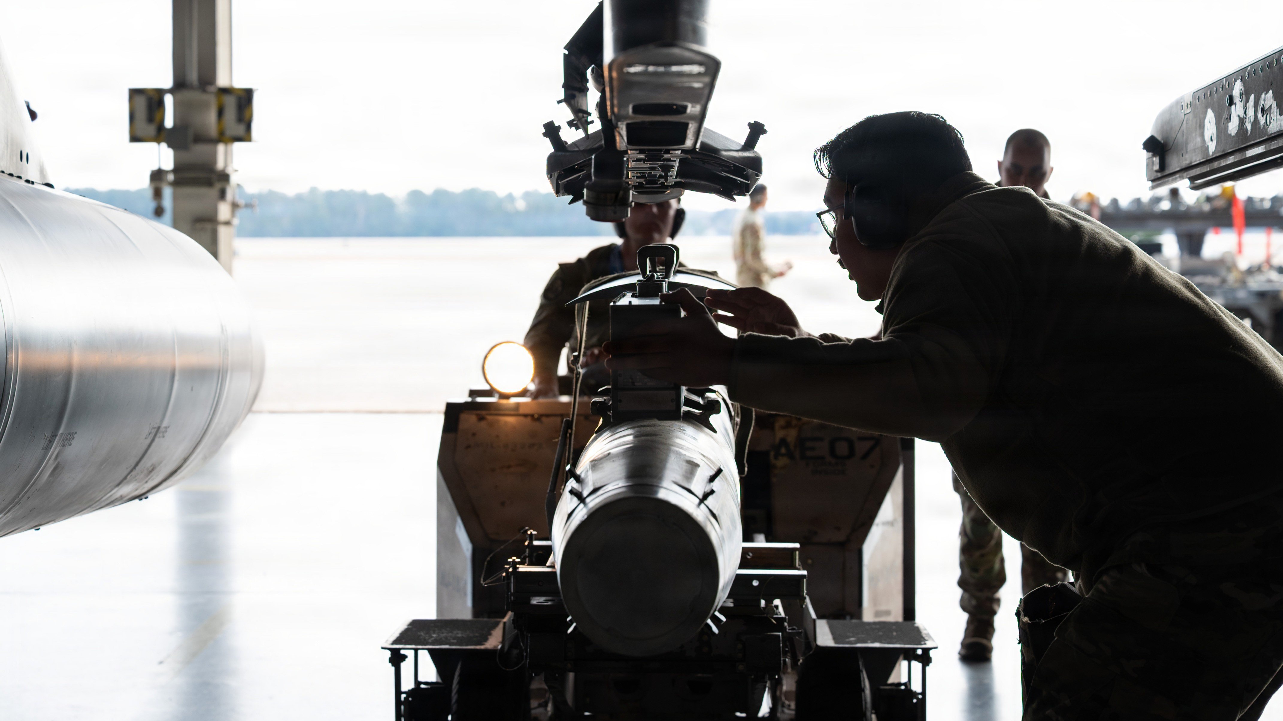 U.S. Air Force Staff Sgt. Oscar Fernandez, 55th Fighter Generation Squadron weapons load crew member, guides Senior Airman Michael Kelly, 55th FGS weapons load crew member, as they load an AGM-88 high-speed anti-radiation missile (HARM) onto a F-16 Fighting Falcon fighter aircraft during the 2026 20th Fighter Wing Load Crew of the Year competition at Shaw Air Force Base, South Carolina, Feb. 3, 2026. Weapons load crew members rely on clear communication, strict adherence to technical guidance and precise execution to ensure aircraft are armed with munitions quickly and correctly.. (U.S. Air Force photo by Senior Airman Mariana Tafur)  Airmen with the 55th Fighter Generation Squadron load an AGM-88 high-speed anti-radiation missile (HARM) onto a F-16 in February 2026. Air Force photo by Senior Airman Mariana Tafur.