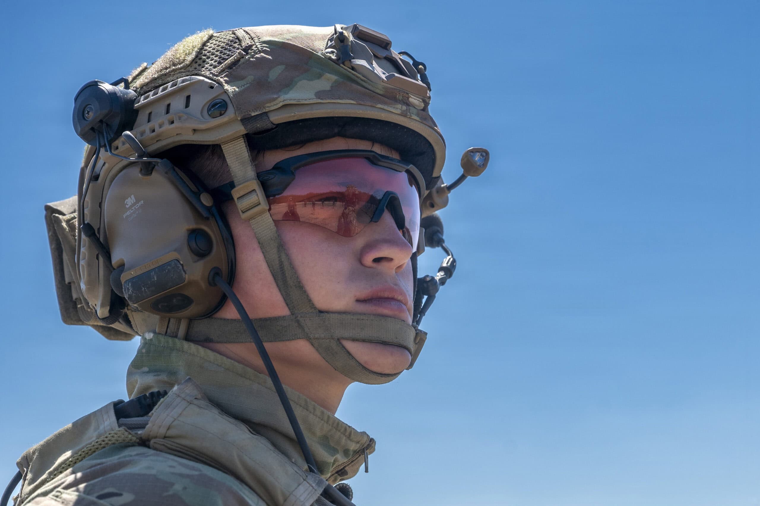 A U.S. Air Force Tactical Air Control Party (TACP) Airman with Detachment 2, 6th Combat Training Squadron, listens to briefing during small arms training at Joint San Antonio–Camp Bullis, Texas, April 8, 2026. TACP training focuses on combat readiness, featuring weapon retention, target engagement under pressure, and combat field skills, preparing Airmen to operate effectively in combat environments. (U.S. Air Force photo by Melissa Hydrick)