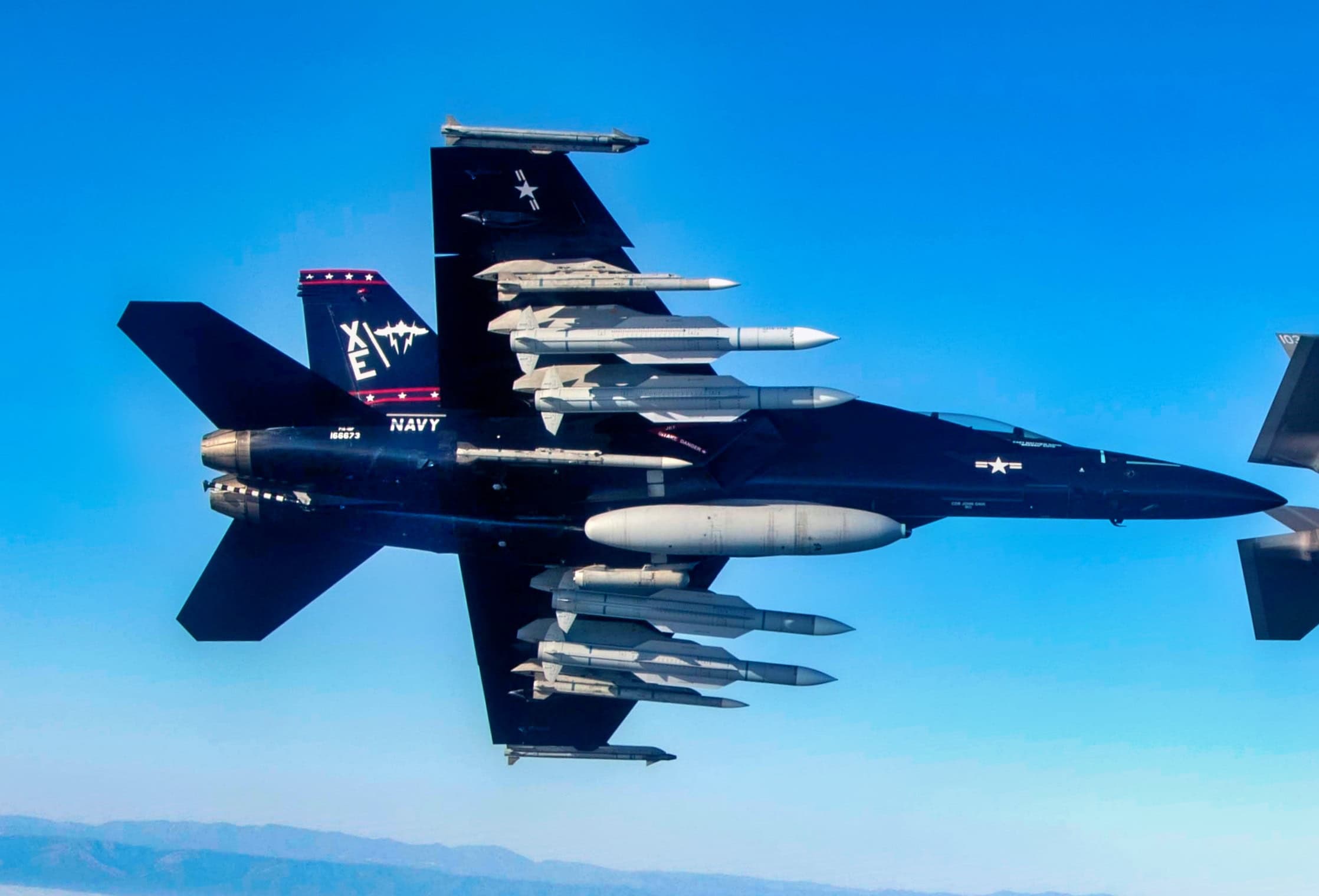 A U.S. Navy F/A-18F and F-35, both assigned to Air Test and Evaluation Squadron (VX) 9, fly over the Point Mugu Sea Range in Southern California with a U.S. Air Force F-15 during Gray Flag 2024 on Sept. 24, 2024. Gray Flag is an annual large-force test event that brings the joint force together to test and evaluate multi-domain systems in a maritime environment, ensuring our nation’s warfighters are equipped with effective, interoperable systems that will help them deter aggression, protect our nation’s prosperity and security, and return home safely to their families. (U.S. Navy photo by Lt. Cmdr. Kory Hughs)
