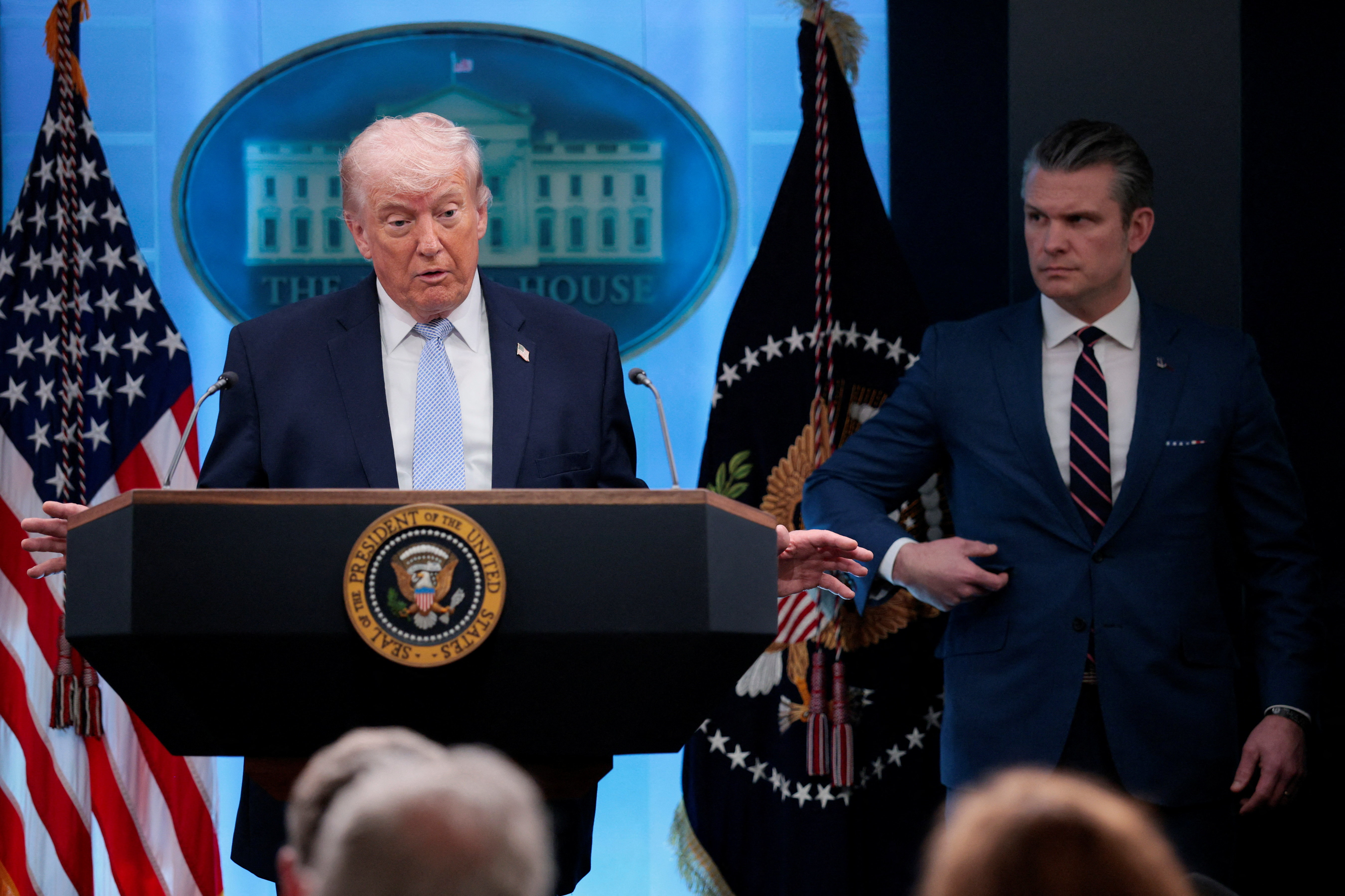 President Donald Trump holds a press conference accompanied by Defense Secretary Pete Hegseth at the White House on April 6. (Evan Vucci/Reuters)