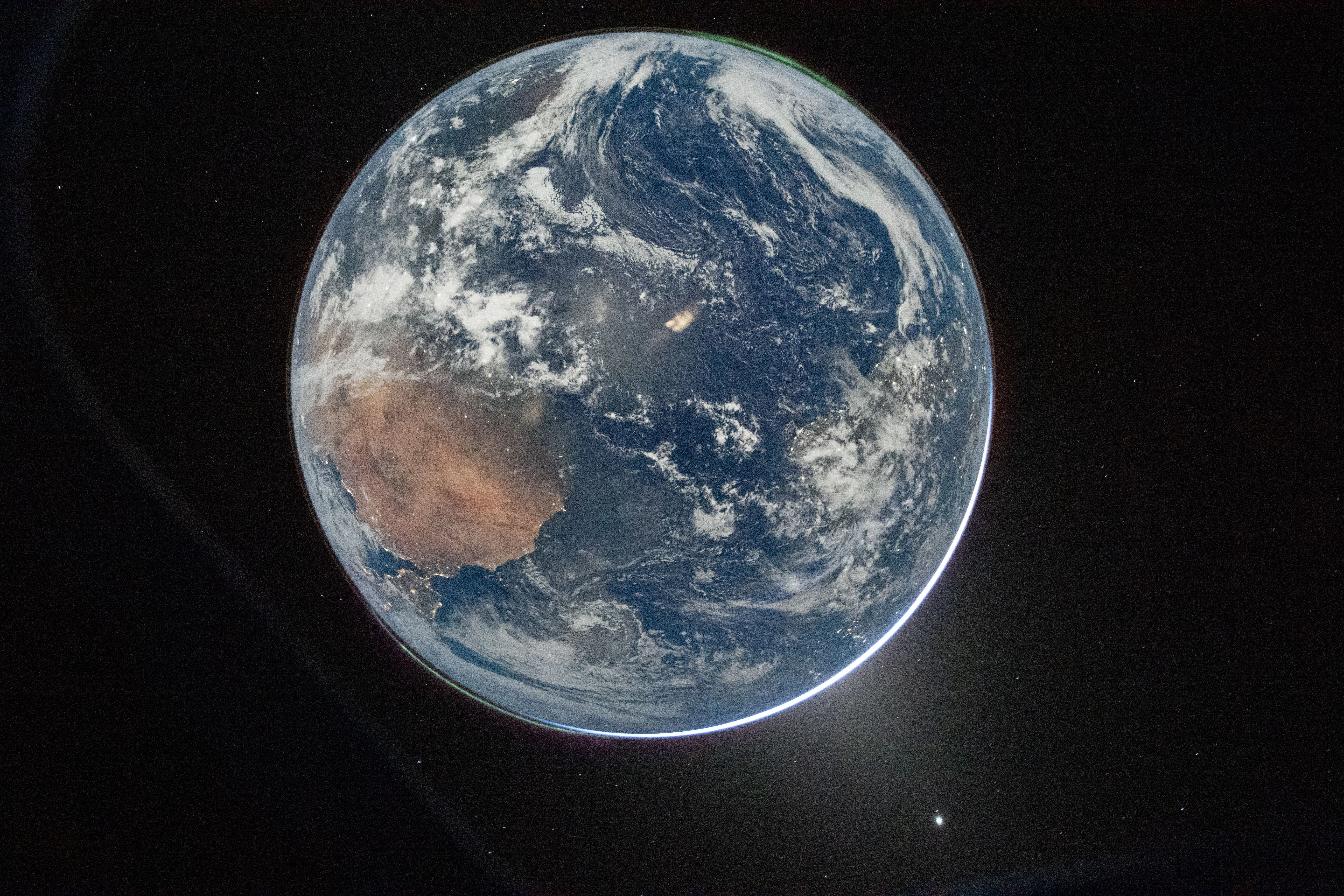 Hello, World! NASA astronaut Reid Wiseman took this picture of Earth from the Orion spacecraft’s window. (Reid Wiseman/NASA)