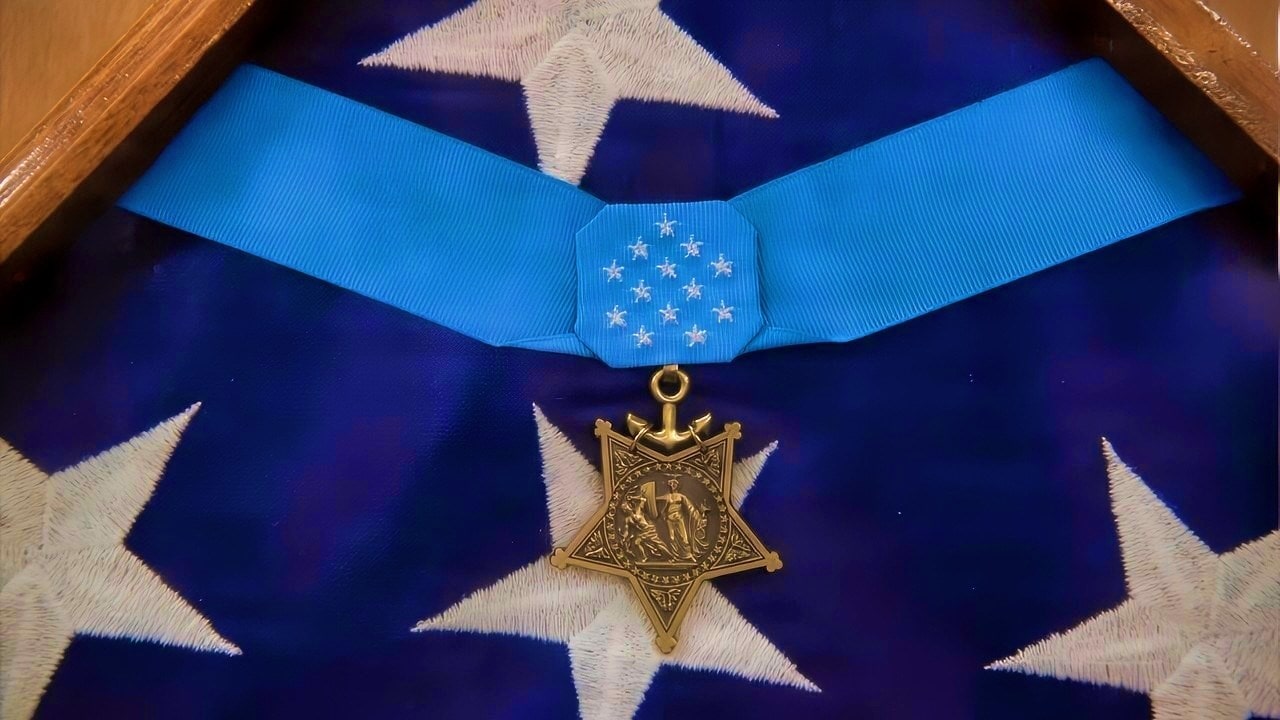 SAN DIEGO, Ca. (Nov. 4, 2025) - The Medal of Honor awarded to Capt. Jacklyn Harold "Jack" Lucas, a U.S. Marine who became the youngest recipient of the distinction at age 17 during World War II, is displayed aboard the ship that received his namesake, the Arleigh Burke-class guided-missile destroyer USS Jack H. Lucas (DDG 125). Jack H. Lucas is the first Flight III warship in the U.S. Navy, marking a significant evolution in surface force combatant capabilities. The mission of Commander, Naval Surface Force, Pacific Fleet is to man, train, and equip the Surface Force to provide fleet commanders with credible naval power to control the sea and project power ashore. (U.S. Navy photo by Mass Communication Specialist 1st Class Sara L. Eshleman)