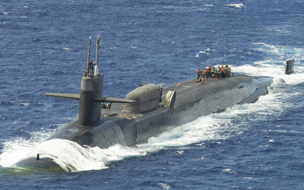 PACIFIC OCEAN (Feb. 9, 2021) Marines assigned to the 1st Force Reconnaissance Company, III Marine Expeditionary Force, assemble a combat rubber raiding craft during a scheduled exercise aboard the guided-missile submarine USS Ohio (SSGN 726). The exercise is part of ongoing III MEF and U.S. 7th Fleet efforts to provide flexible, forward-postured and quick-response options to regional commanders. (U.S. Navy photo by Mass Communication Specialist 1st Class Juan Antoine King) 210209-N-LD174-1006