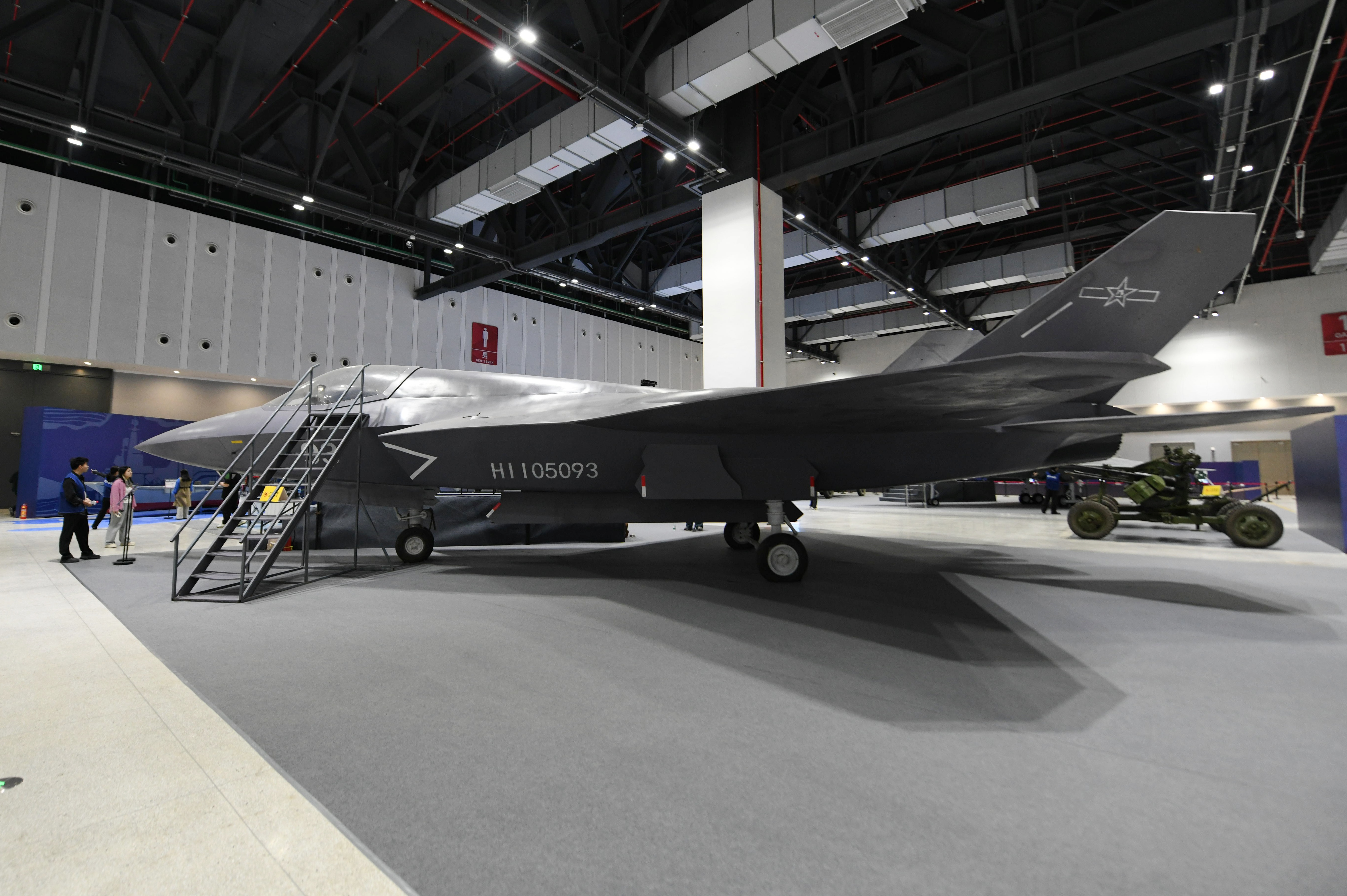 Viewers observe China's J-35A stealth fighter model at the 2026 National Defense Military Technology Carnival in Hangzhou, Zhejiang Province, China, on April 25, 2026. (Costfoto/NurPhoto via Getty Images)