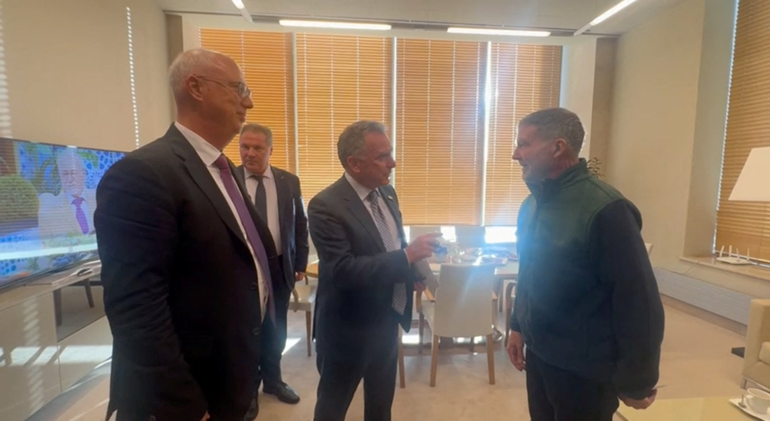 U.S. Special Envoy Steve Witkoff, middle, and Russian Presidential Envoy Kirill Dmitriev, left, attend a meeting with Stephen Hubbard, right, in St. Petersburg, Russia, Oct. 21, 2026. (Video screenshot/Reuters)