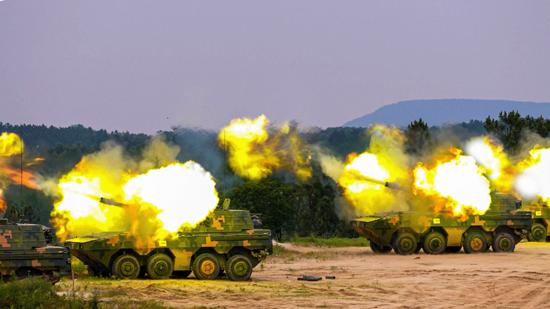 Chinese vehicles engage in live-fire exercises.