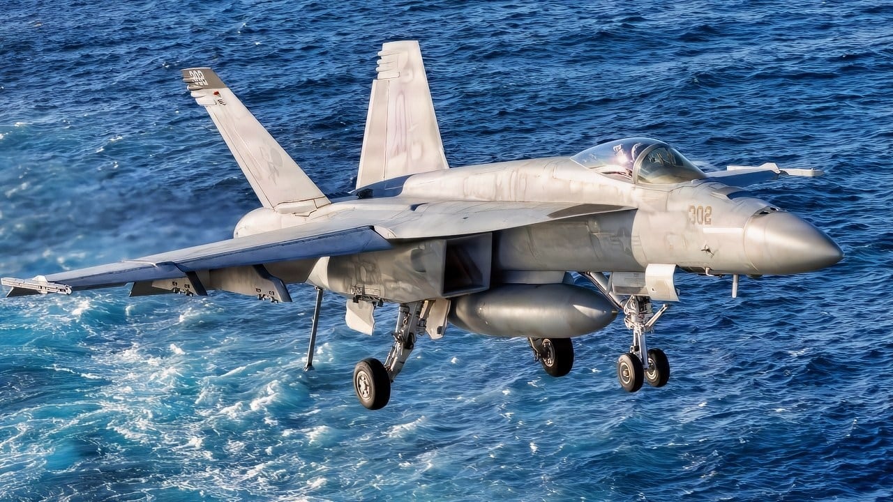 An F/A-18E Super Hornet aircraft approaches the flight deck of the world's largest aircraft carrier, Ford-class aircraft carrier USS Gerald R. Ford (CVN 78), Nov. 17, 2025. U.S. military forces are deployed to the Caribbean in support of the U.S. Southern Command mission, Department of War-directed operations, and the president's priorities to disrupt illicit drug trafficking and protect the homeland. (U.S. Navy photo)