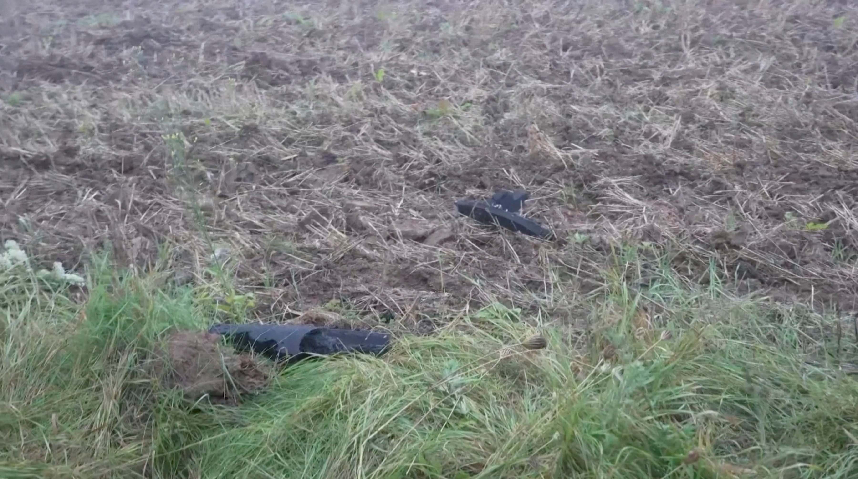 Debris of what, according to the Lithuanian government, was a drone shot down by a NATO fighter jet, lies on the ground near Pratkunai village, Lithuania, Sept. 15, 2026, in this screen grab from a handout video. (Lithuanian Army/Handout via Reuters)