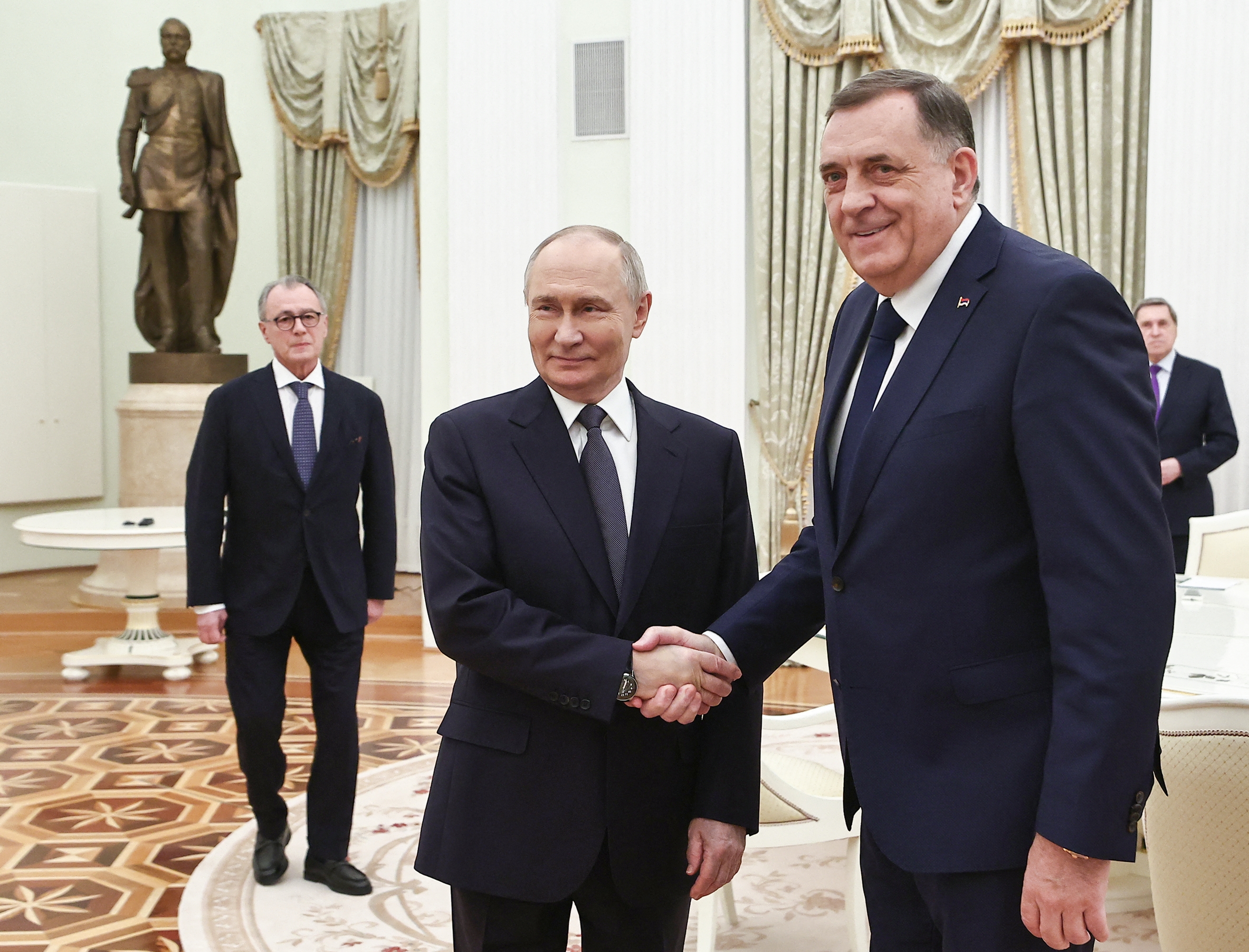 In this pool photograph distributed by the Russian state agency Sputnik, Russia's President Vladimir Putin meets with Bosnian Serb leader Milorad Dodik at the Kremlin in Moscow on April 1, 2025. (Mikhail Tereshchenko/POOL/AFP via Getty Images)