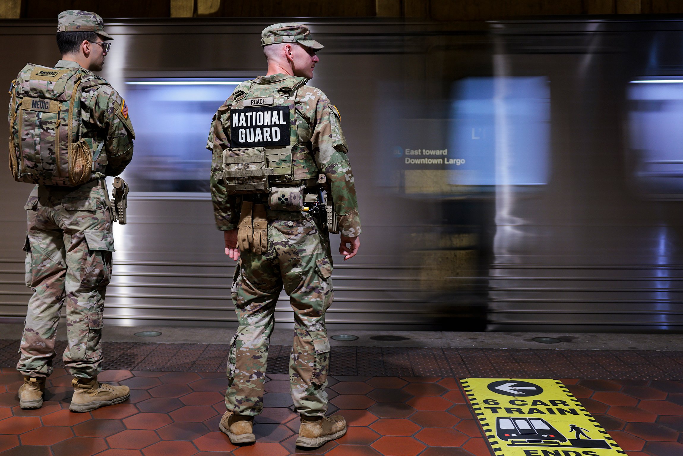 WASHINGTON, DC - APRIL 15: Members of the National Guard wait to board the WMATA Metro on April 15, 2026 in Washington, DC. President Donald Trump deployed members of the National Guard in August 2025 and he says he wants them to remain in the city. (Photo by Heather Diehl/Getty Images)