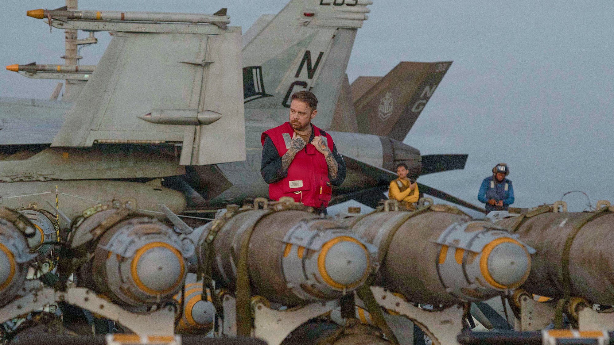 U.S. Sailors transfer ordnance on the flight deck of Nimitz-class aircraft carrier USS Abraham Lincoln (CVN 72), in the Arabian Sea, Feb. 27, 2026.