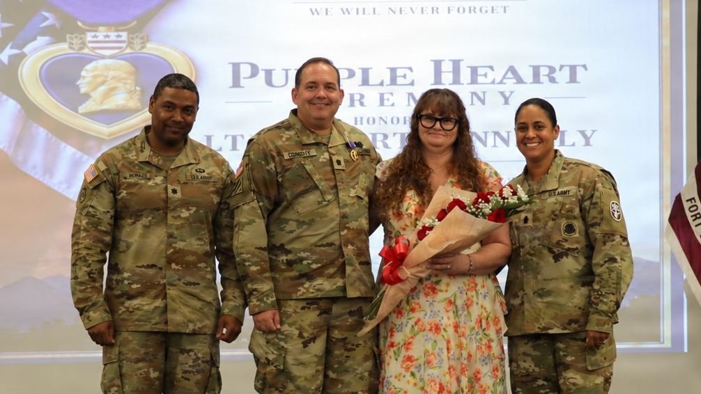 Lt. Col. Robert J. Connolly, 103rd Expeditionary Sustainment Command, U.S. Army Reserves (middle in uniform), stands with his wife (to his left) and Fort Bliss’s Soldier Recovery Unit leadership after receiving the Purple Heart medal and award, in a ceremony held September 23, 2026, at the 1st Armored Division and Fort Bliss Museum.
