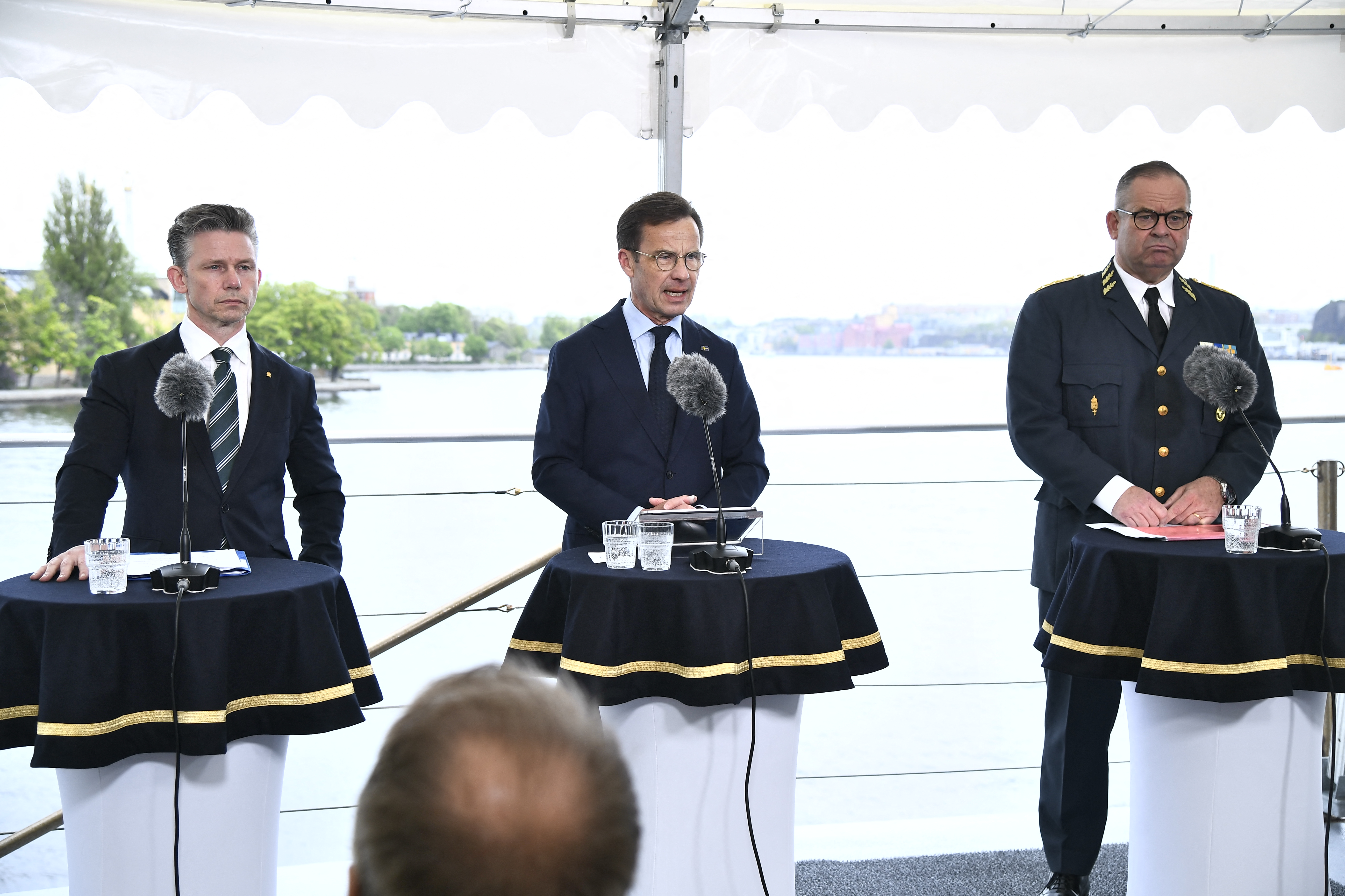 Sweden's Defense Minister Pal Jonson, Prime Minister Ulf Kristersson and Chief of Defence Staff and Supreme Commandant Gen. Michael Claesson deliver a press conference aboard the Visby-class corvette HMS Haernoesand in Stockholm, Sweden, on May 19, 2026. (Lars Schroder / TT News Agency / AFP via Getty Images)