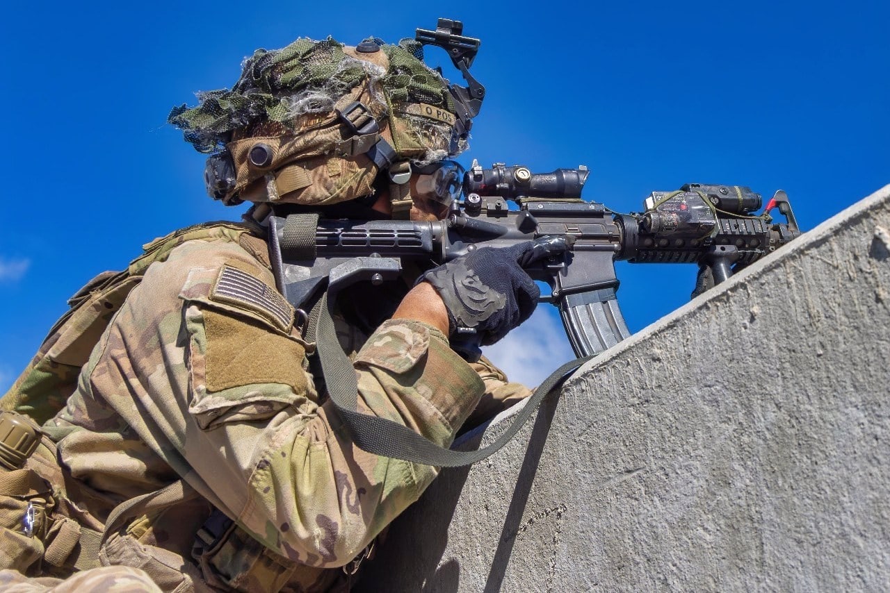 U.S. Army Soldier Pfc. Eric Rivera, assigned to Delta Troop, 1st Platoon, Multipurpose Company, 3rd Squadron, 4th Cavalry Regiment, 3rd Mobile Brigade, 25th Infantry Division, pulls security before a Ghost-X drone conducts reconnaissance. The mission was part of the Joint Pacific Multinational Readiness Center Rotation 26-01, which integrated U.S. forces, multinational partners, and joint capabilities to train tactics, techniques, and procedures required to dominate jungle and archipelagic terrain during large-scale combat operations. (U.S. Army photo by Pfc. Jose Nunez)