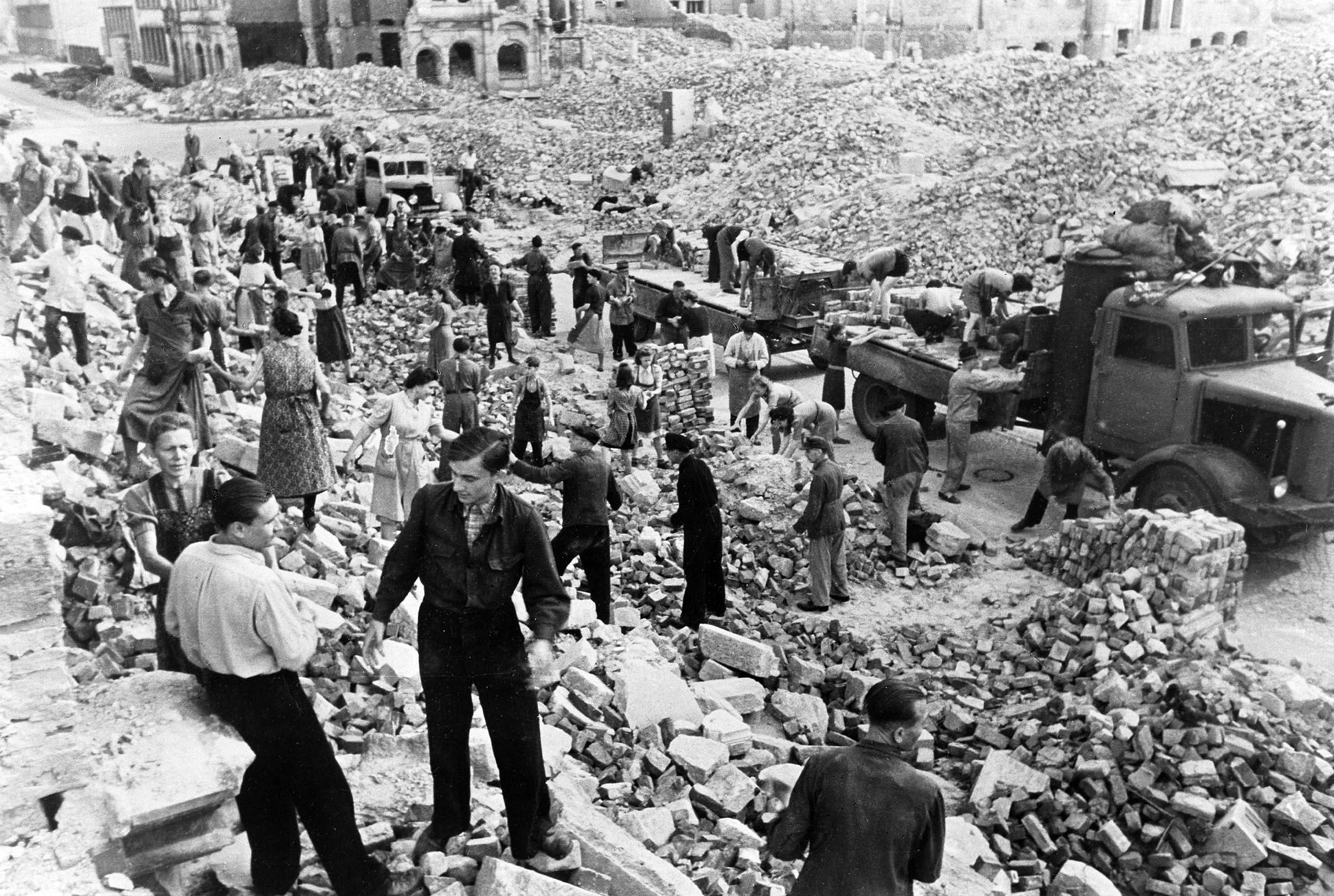 Dresden residents and emergency personnel cleaning up the rubble following the February 1945 Allied bombings. (Richard Peter/Getty Images)
