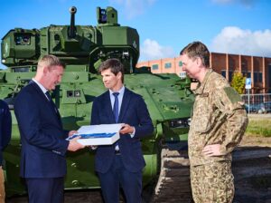 Alejandro Page (center) is handing the symbolic key to Minister of Defense Raivis Melnis and Chief of Defense Lieutenant General Kaspars Pudāns. (Photo: GDELS)