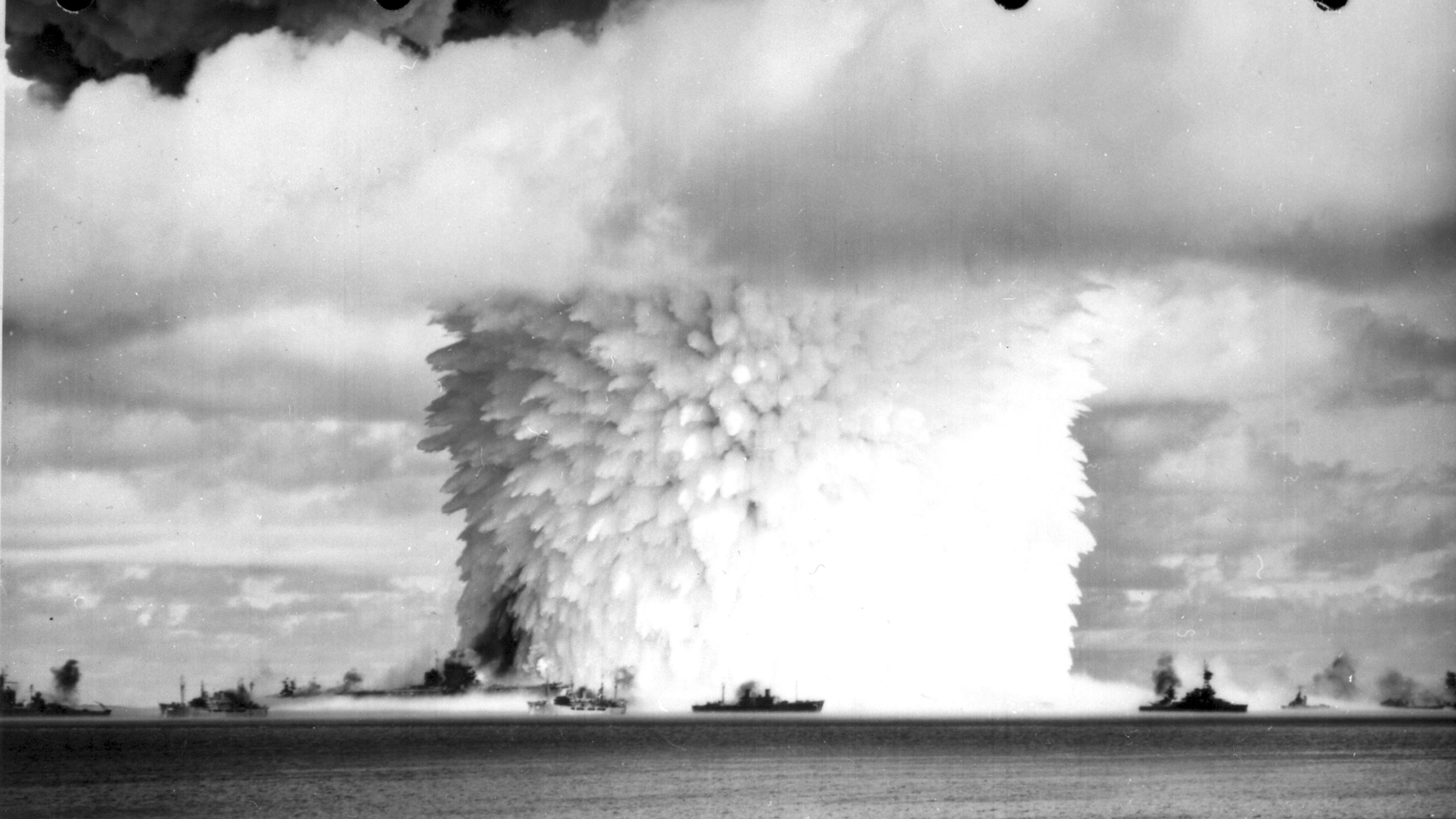 Image: (Original Caption) View of "Baker" atomic bomb explosion at Bikini Atoll on July 25, 1946 -- the last of three American tests. The blast sent up a column of water 5000 feet high and 2000 feet wide at the base. Photo via Getty Images) 