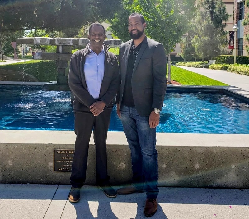 Michael Hyon Johnson with his father after the author earned his Master of Fine Arts degree at Chapman University. (Photo courtesy of the author)