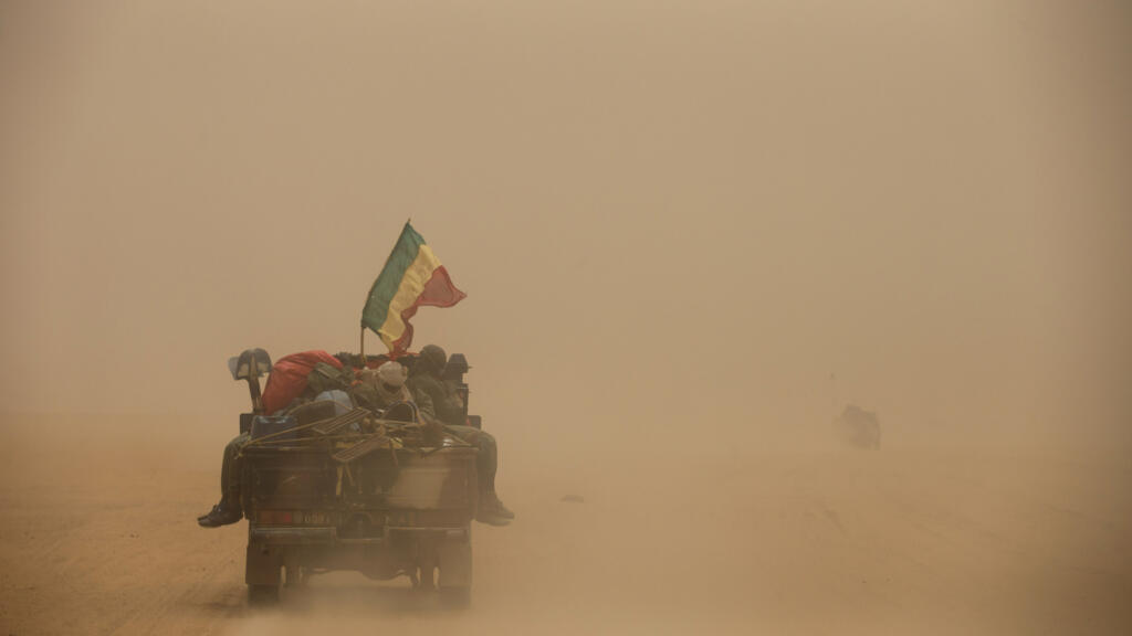 Malian army convoy moving through the desert on the Gao road in northern Mali