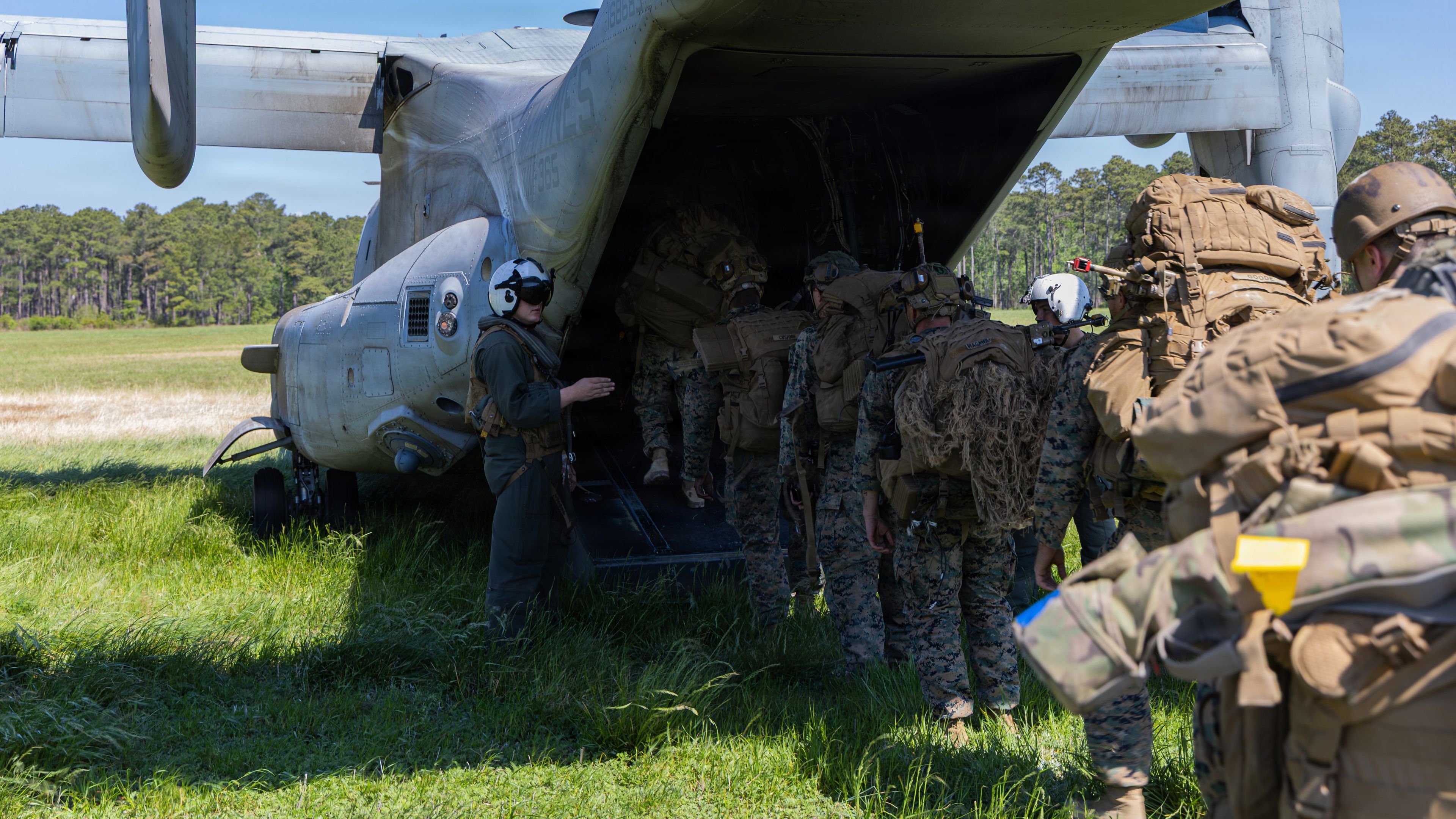 U.S. Marines with 3rd Battalion, 2nd Marine Regiment, 24th Marine Expeditionary Unit, board a MV-22B Osprey during an embassy reinforcement scenario as part of MEU exercise on Marine Corps Base Camp Lejeune, North Carolina, April 14, 2026. This exercise sharpened the 24th MEU’s command and control capabilities, ensuring seamless communication and decisive action for our upcoming deployment. (U.S. Marine Corps photo by Lance Cpl. Payton Walley)