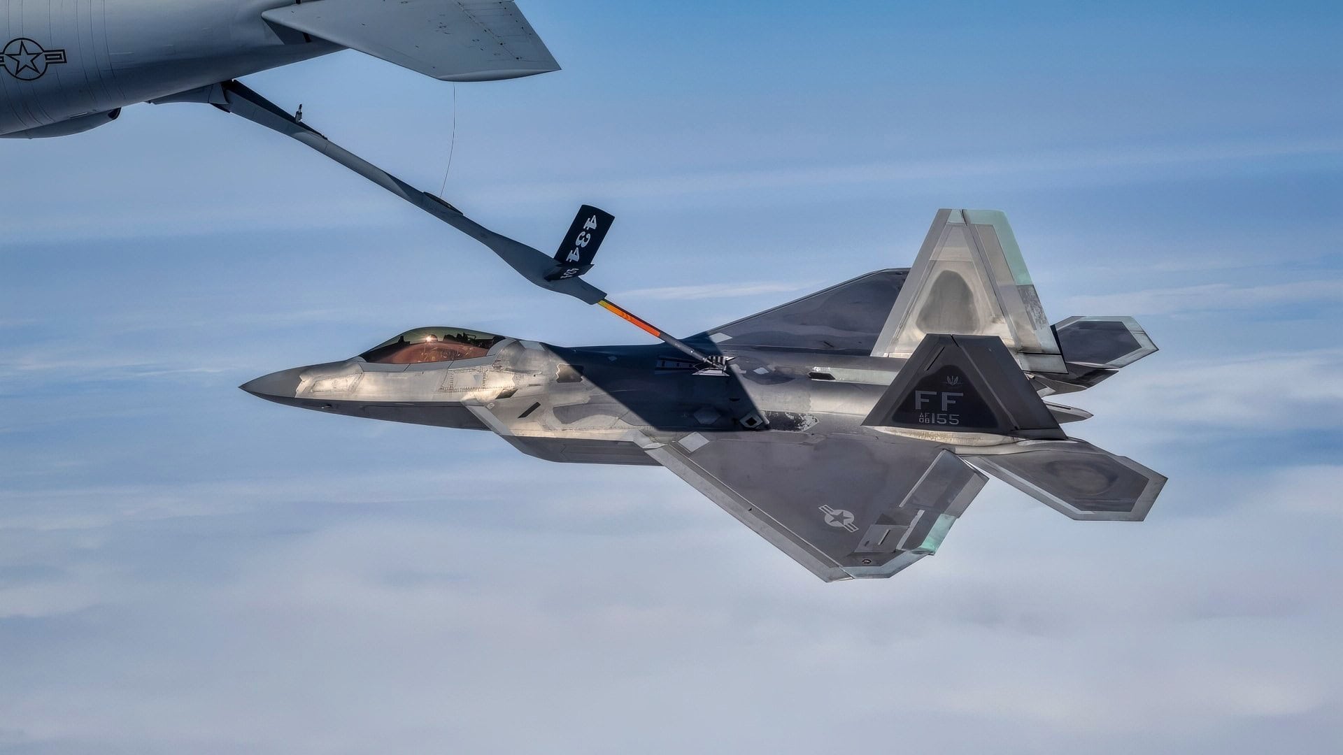 A U.S. Air Force F-22 Raptor and a KC-135 Stratotanker, assigned to the 434th Air Refueling Wing, Grissom Air Reserve Base, Ind., conduct aerial refueling over the continental United States, Aug. 21, 2018, during the Northern Lightning 18-2 exercise. Northern Lightning is one of seven Air National Guard joint accredited exercises held at a Combat Readiness Training Center and provides tailored, cost-effective and realistic combat training for participating units in a joint and multinational environment. (U.S. Air National Guard photo by Tech. Sgt. Mary E. Greenwood)