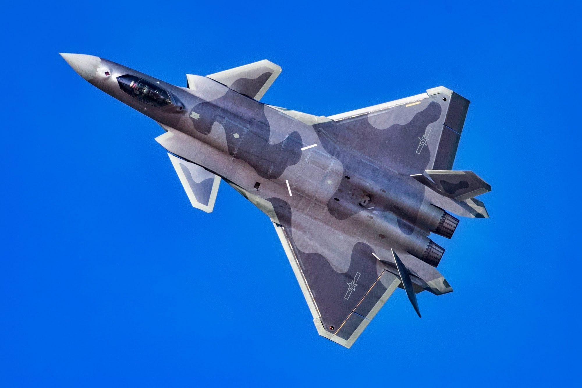 Chinese J-20 stealth fighter in flight representing PLA aviation industry output