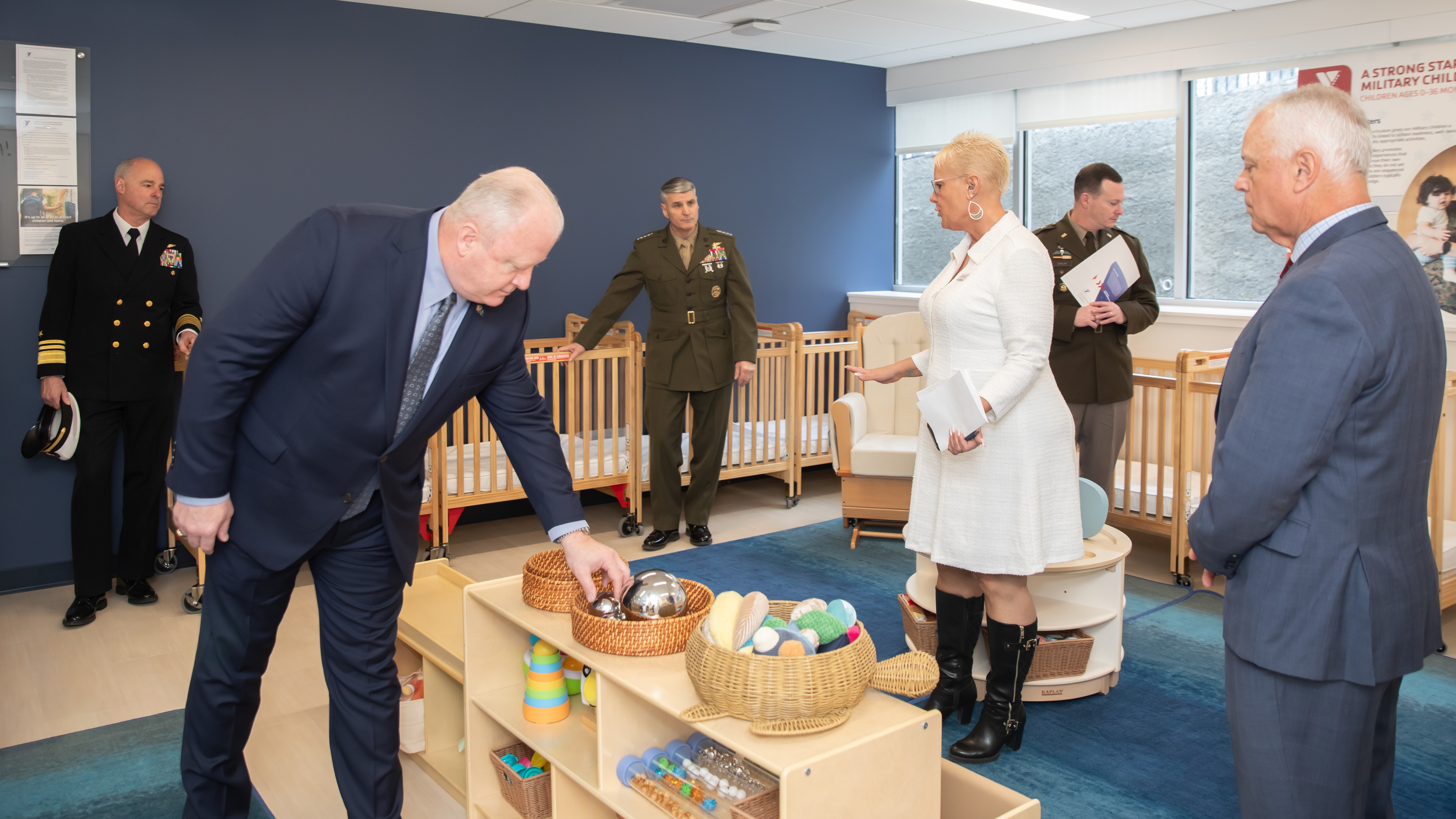 Officials tour a new child care facility for military children in Arlington, Va., on Feb. 25. (Trish Alegre-Smith via Virginia Johnston)