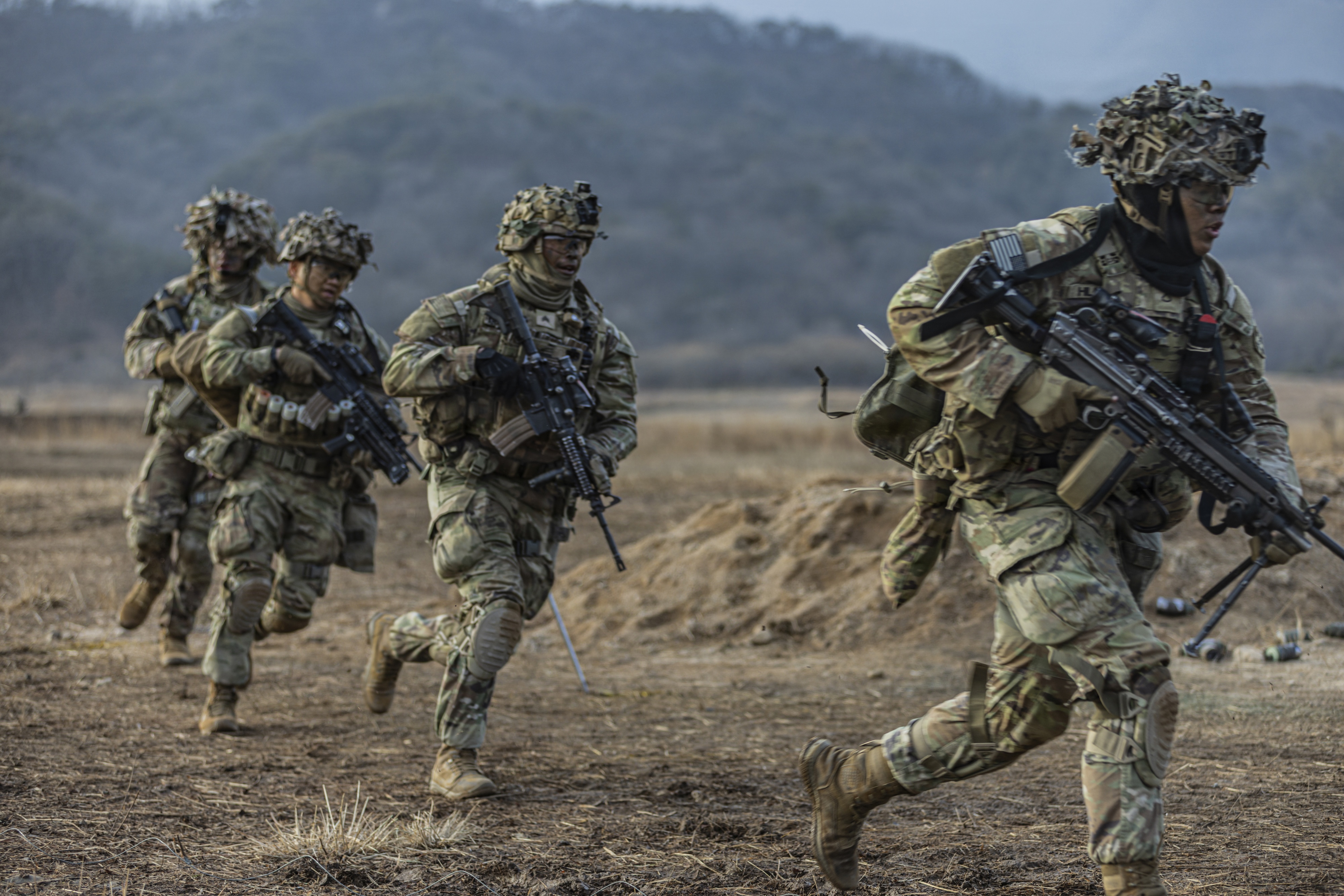 Soldiers maneuver during a combined arms live-fire exercise. (Sgt. Fabrice Bodjona/U.S. Army)