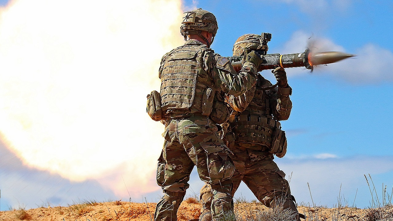 Spc. Chengjie Liu (right), fires an AT-4 anti-tank weapon as Sgt. Jacob Saccameno, both infantrymen assigned to Headquarters and Headquarters Troop, 3rd Squadron, 2nd Cavalry Regiment, supervises and assists during an anti-tank and air defense artillery range, April 23, at Adazi Military Base, Latvia. American and Latvian soldiers trained using a variety of weapons, including Javelin anti-tank missiles, Carl Gustav recoilless anti-tank rifles and the RBS-70 Short-range air defense laser guided missile system. Soldiers from five North Atlantic Treaty Organization nations, including Canada, Germany and Lithuania, have been conducting a variety of training together during Summer Shield XIII, an annual two-week long interoperability training event in Latvia. (U.S. Army photo by Sgt. Paige Behringer)